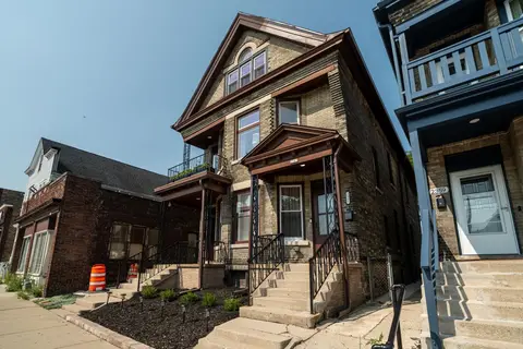 Street-level view of the historic home and its front entrance