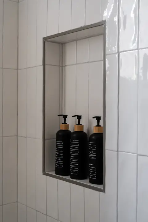 Shower dispensers with shampoo, conditioner, and body wash