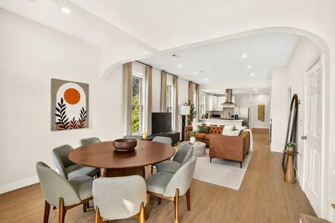 Open living and dining area with seating