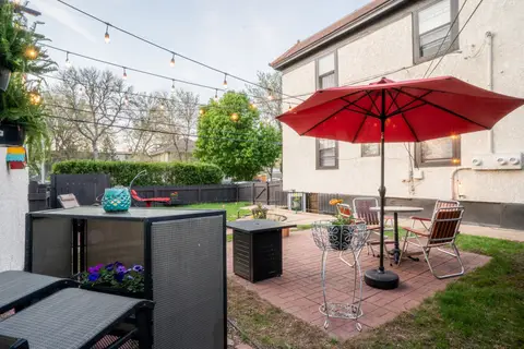 Table and chairs on the shared brick patio