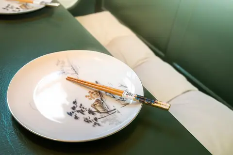 Table set with chopsticks on the banquette