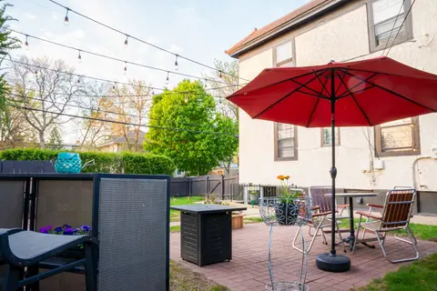 The shared backyard in daylight, looking toward the building