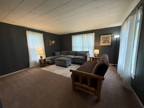 Living room with a large sectional and a full-size futon