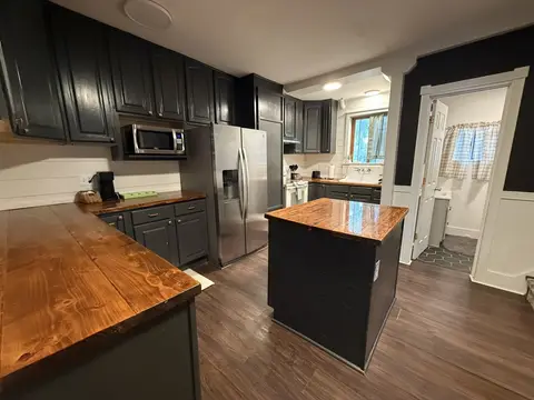 Kitchen with a full-size refrigerator and microwave
