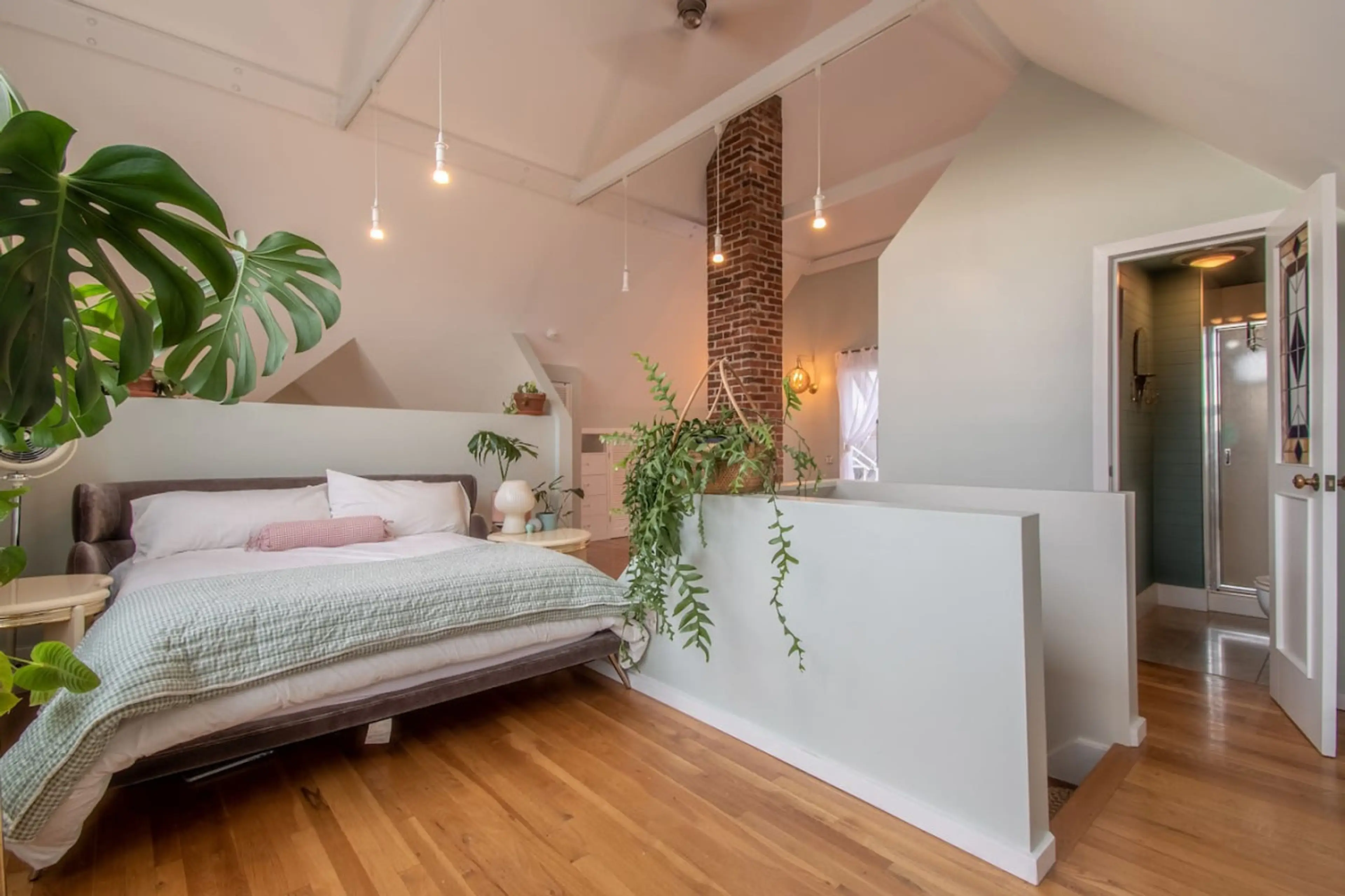 Loft is on the second floor of the home with beautiful large windows. The room features a queen bed and a smart TV.