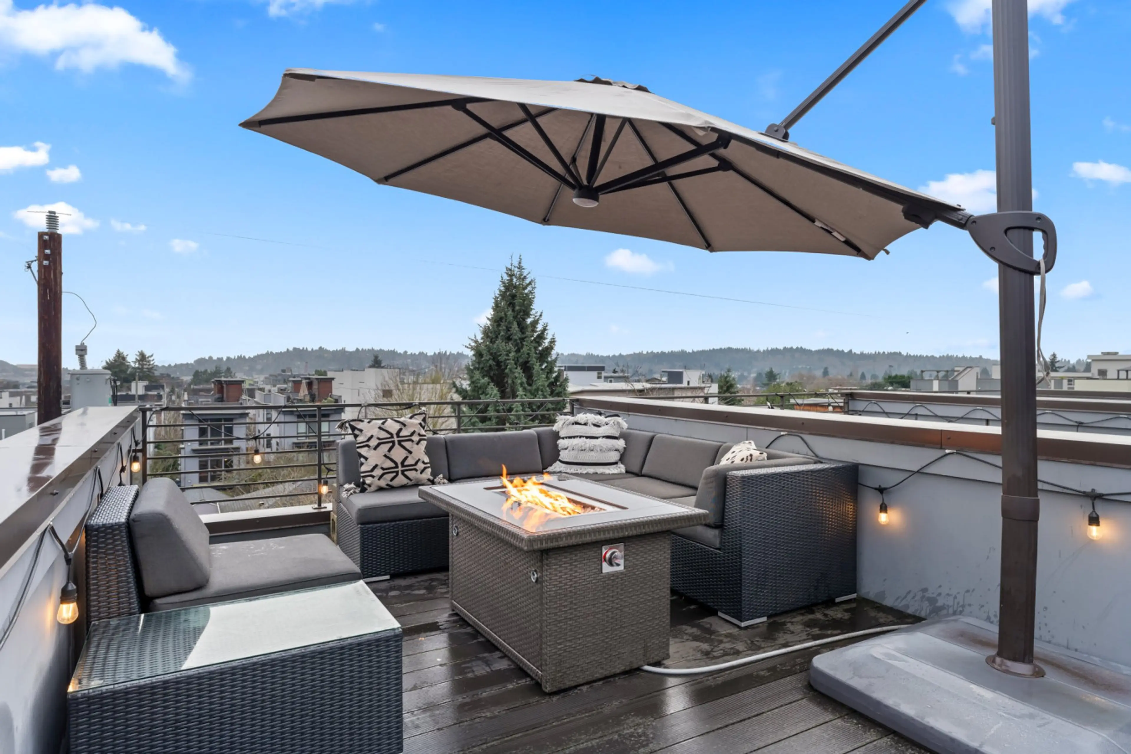 A firepit with cozy sofas, perfect for night gatherings and outdoor dining.