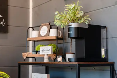 Coffee maker in the bedroom.