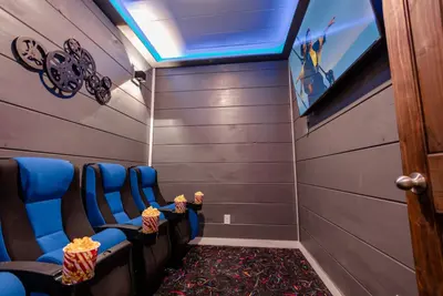 Home movie theater with a huge HDTV.