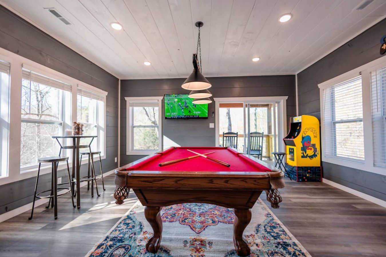 Dive into entertainment in this cabin’s game room, with a pool table and arcade games to enjoy.