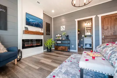 Bedroom with a large HDTV.