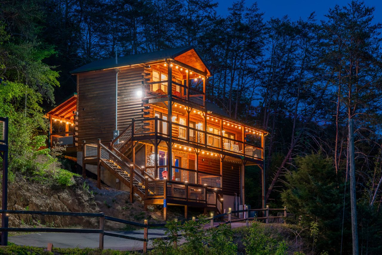 A perfect retreat in the Great Smoky Mountains—where the glow of the cabin meets the magic of the stars above.