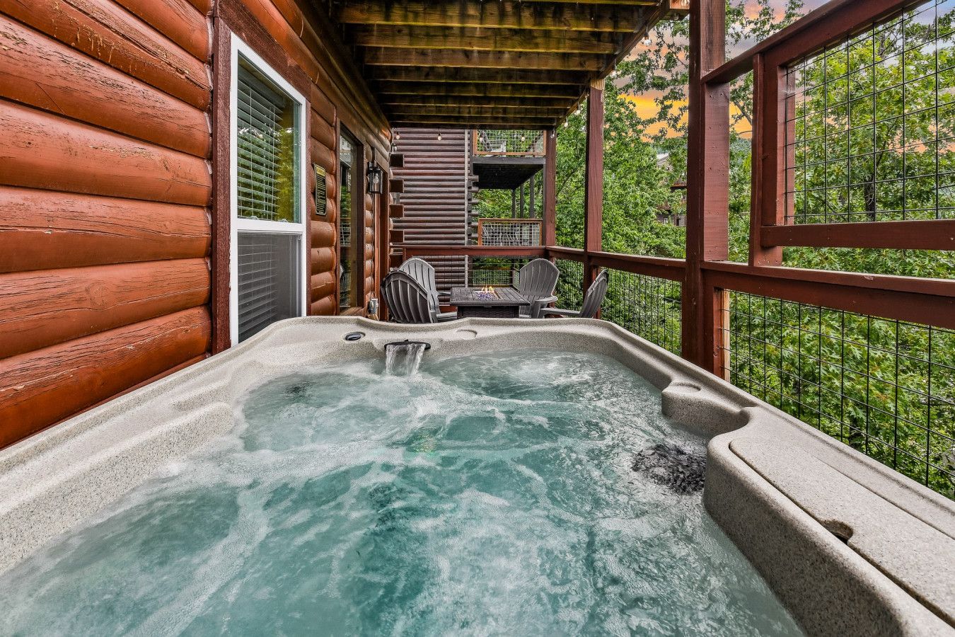 Relax in a premium hot tub with stunning mountain views.