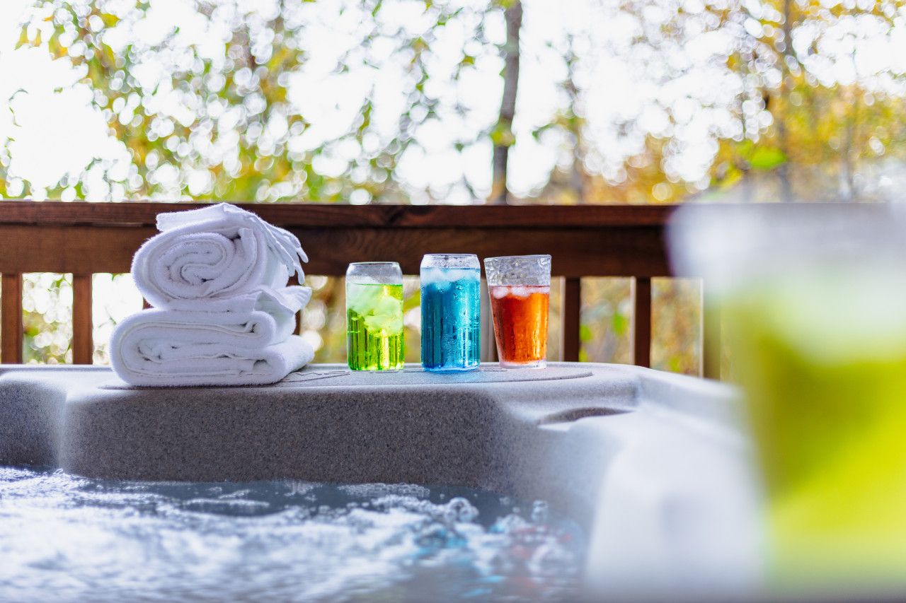 Drinks, towels, and bubbles—your hot tub relaxation station.