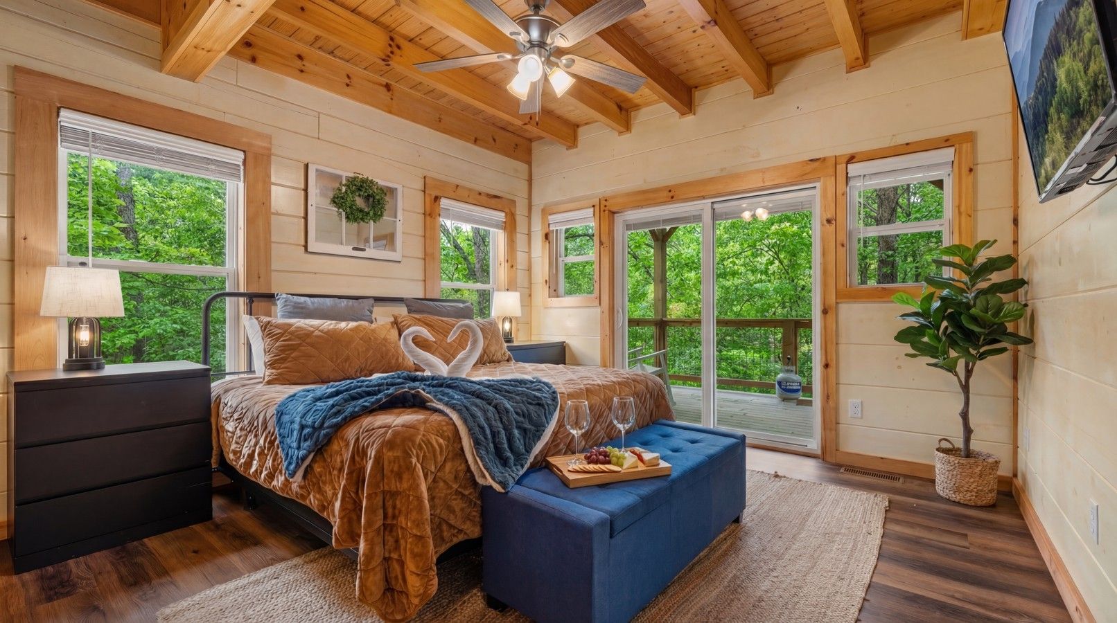 Retreat to a private master suite with direct access to the deck and hot tub, perfect for peaceful mornings and relaxing evenings.