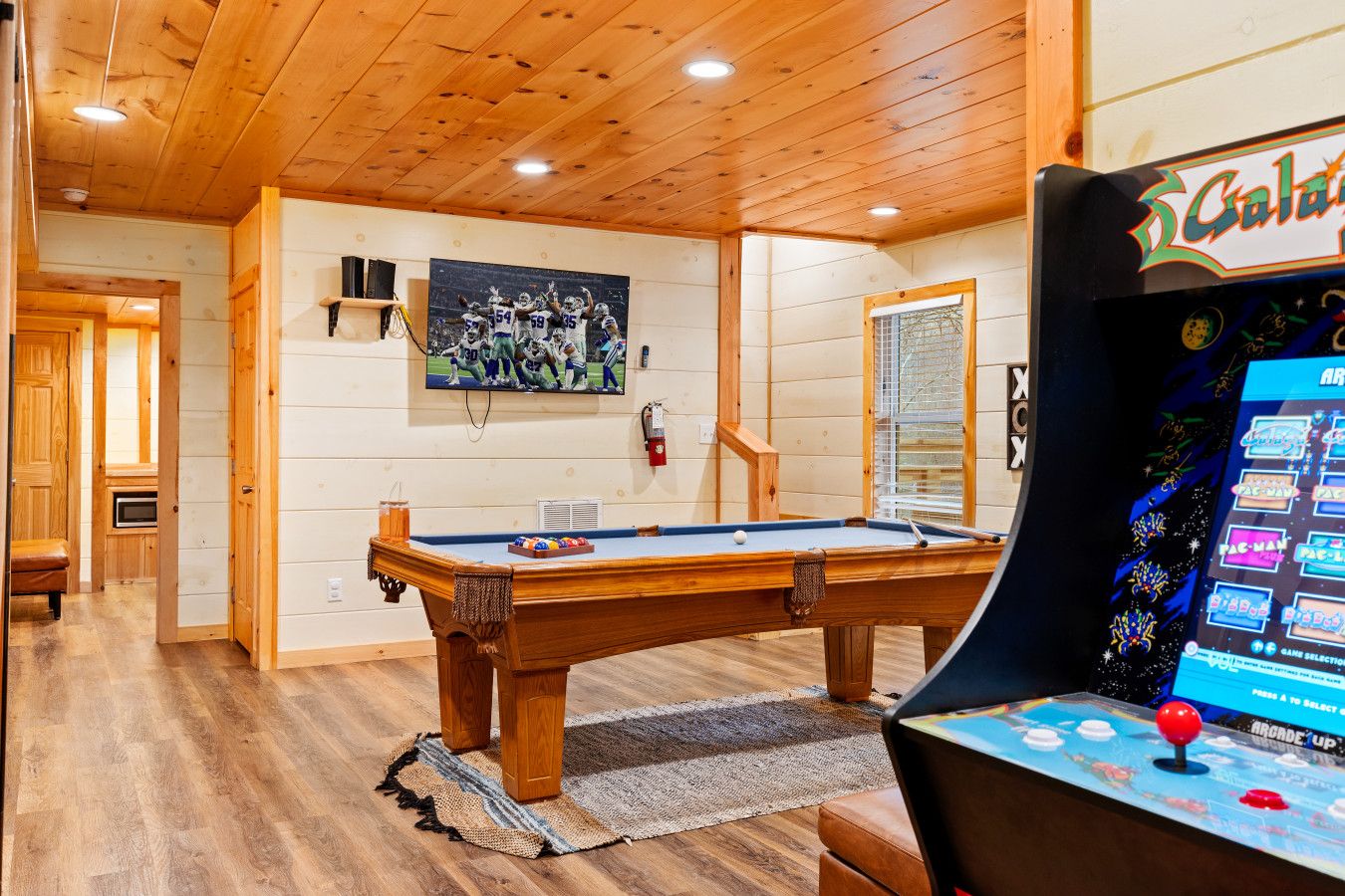 This cabin offers a game room full of fun, perfect for all ages to enjoy together.