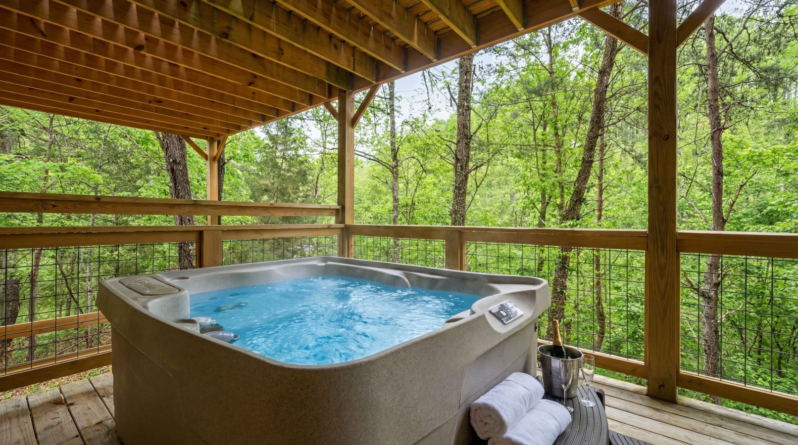 Unwind in the hot tub with peaceful forest views and a calming mountain atmosphere.