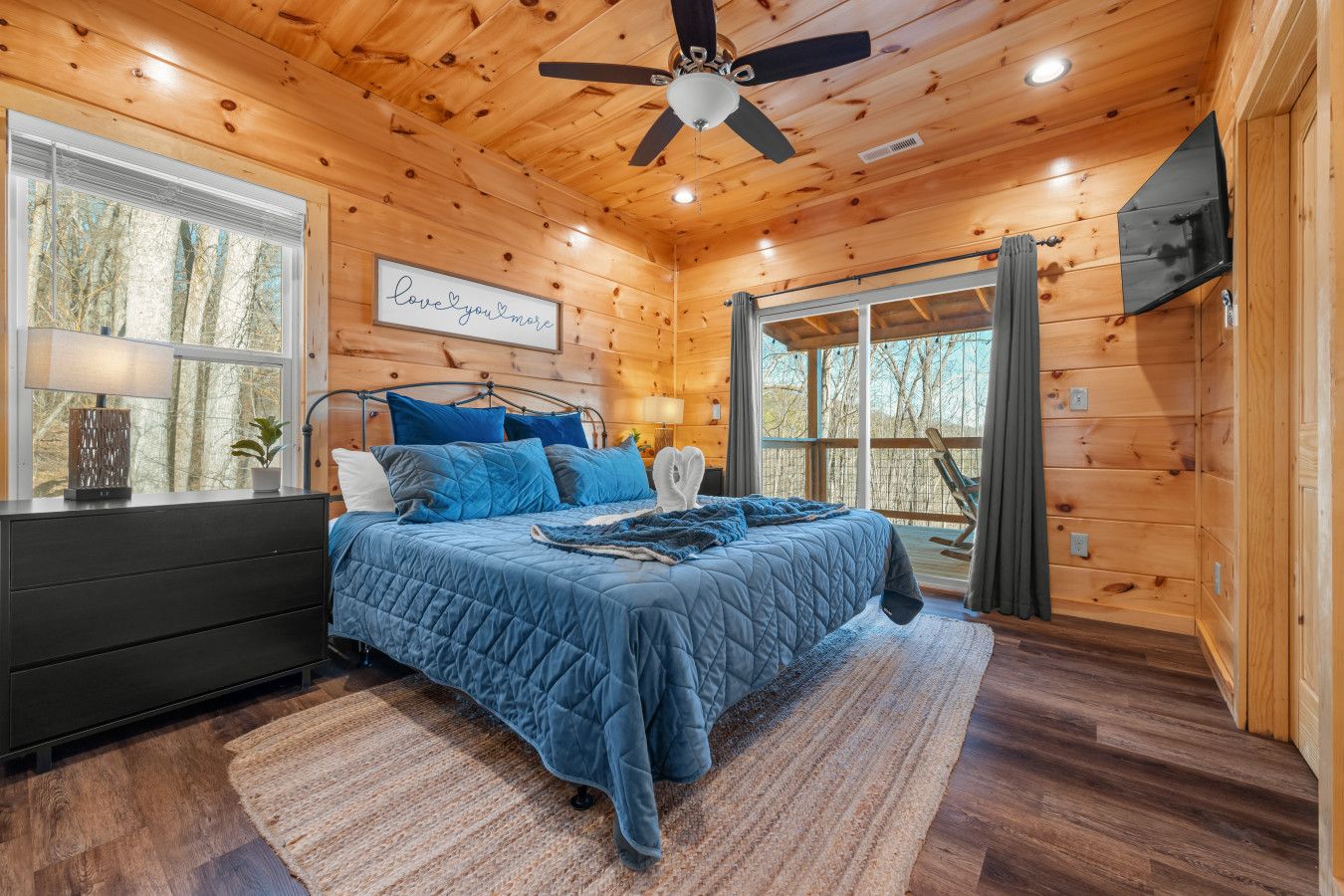 This cabin features comfortable beds, premium linens, and a spacious deck to enjoy the Smoky Mountain views.
