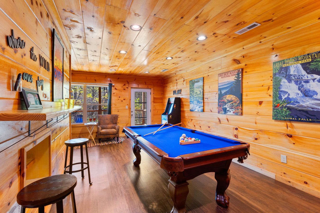 In this cabin, fun meets relaxation—enjoy pool and arcade games with panoramic mountain views right from the deck.