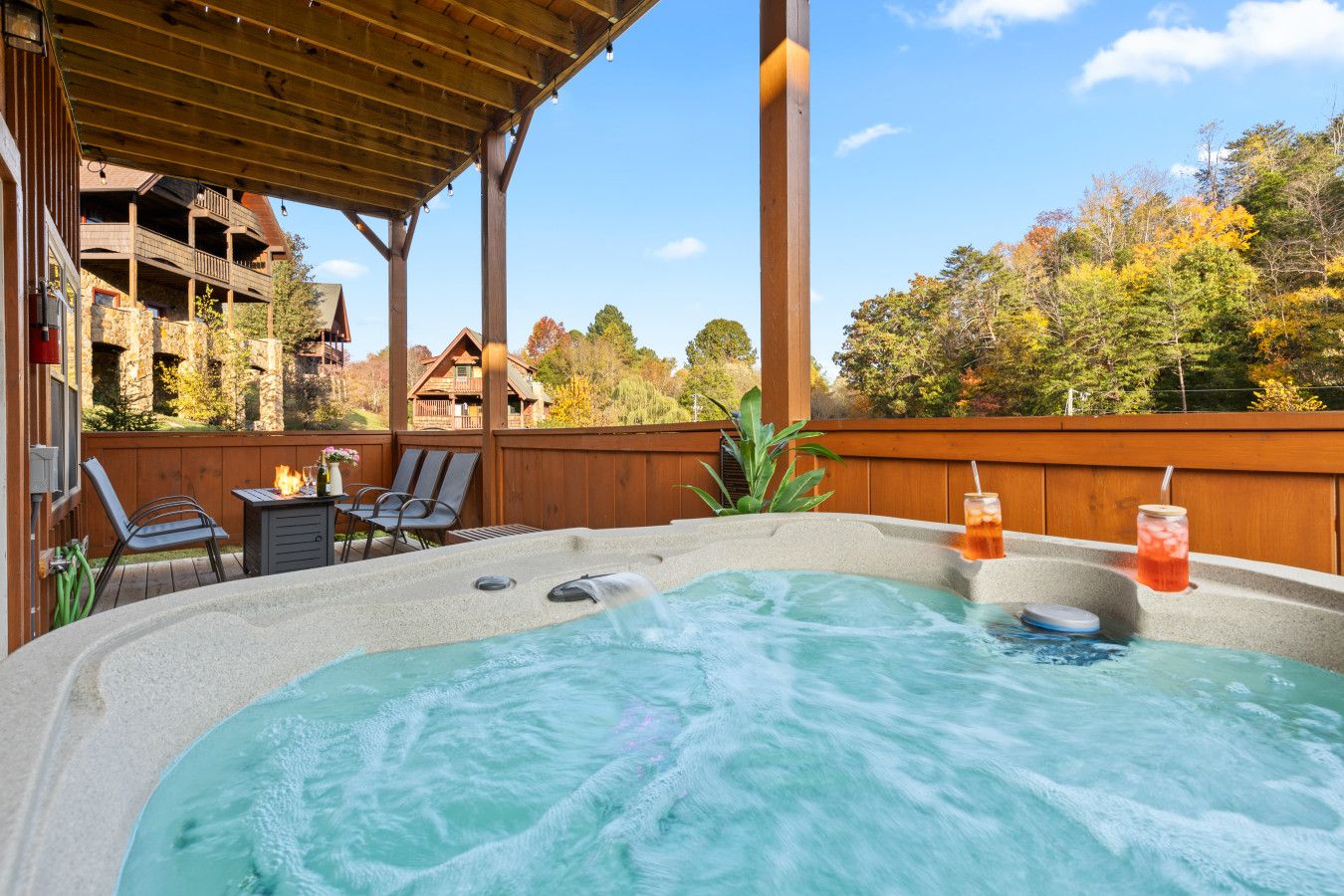 Experience this cabin’s private hot tub—cocktails, forest views, and total bliss.