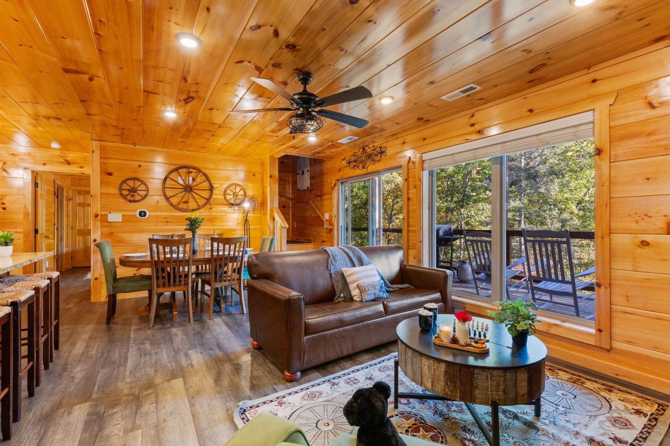 Gather in the spacious open-concept living room with direct access to the main deck, perfect for relaxing together.