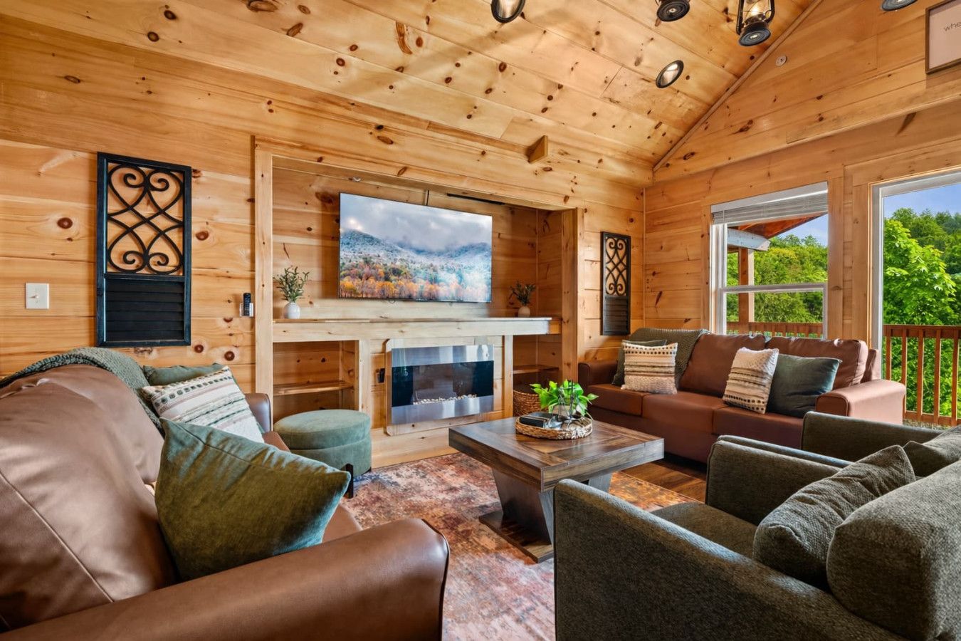 Cozy up by the fireplace while soaking in sweeping mountain views through every window.