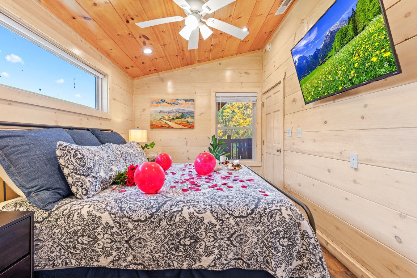 This cabin’s master suite is designed for love—soft lighting, breathtaking views, and private access to the deck.