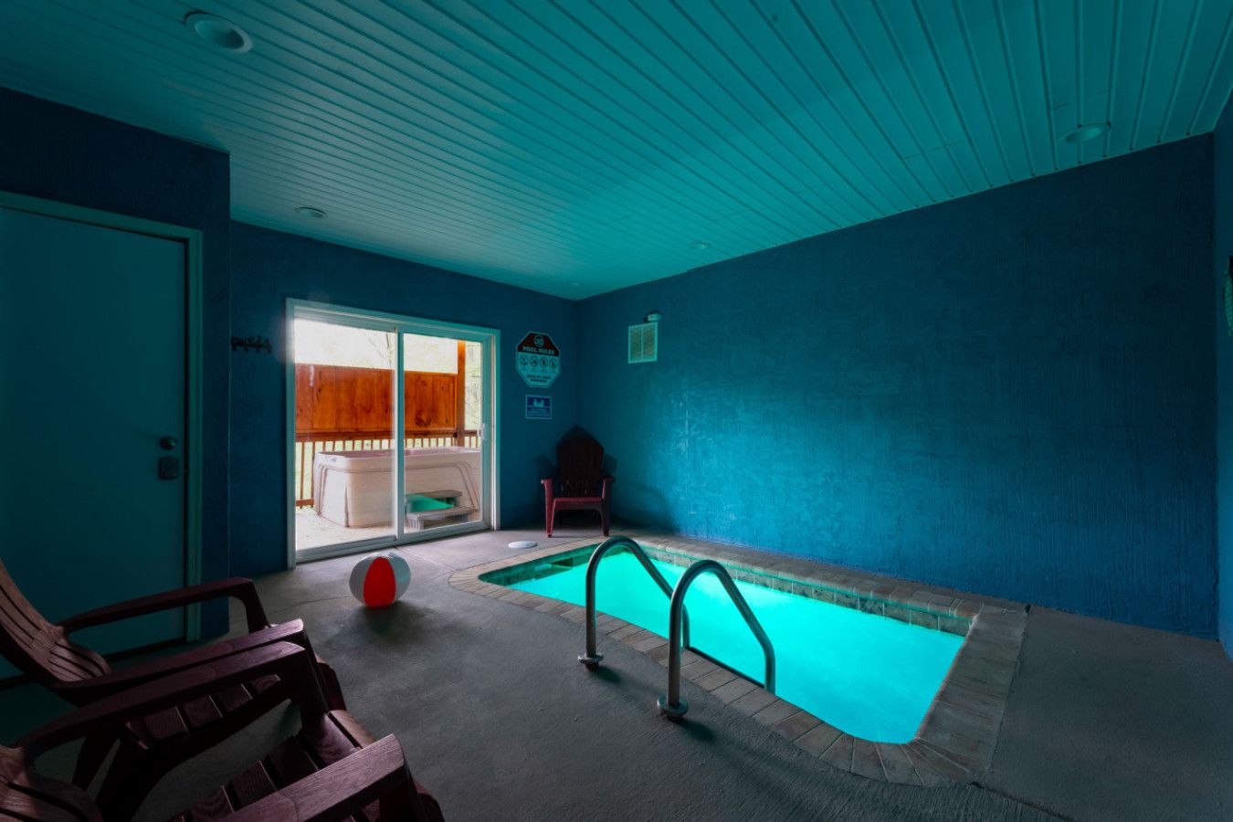 A private oasis awaits in this cabin—immerse yourself in the glow of the night with a stunning indoor pool.