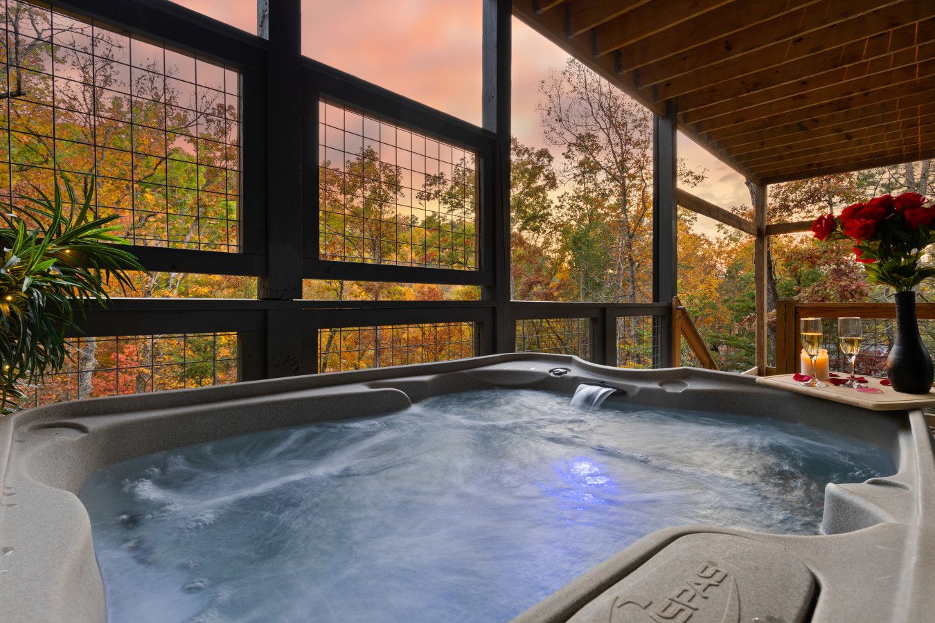 Escape to this cabin and relax in the jacuzzi as the sun sets, offering a tranquil moment.