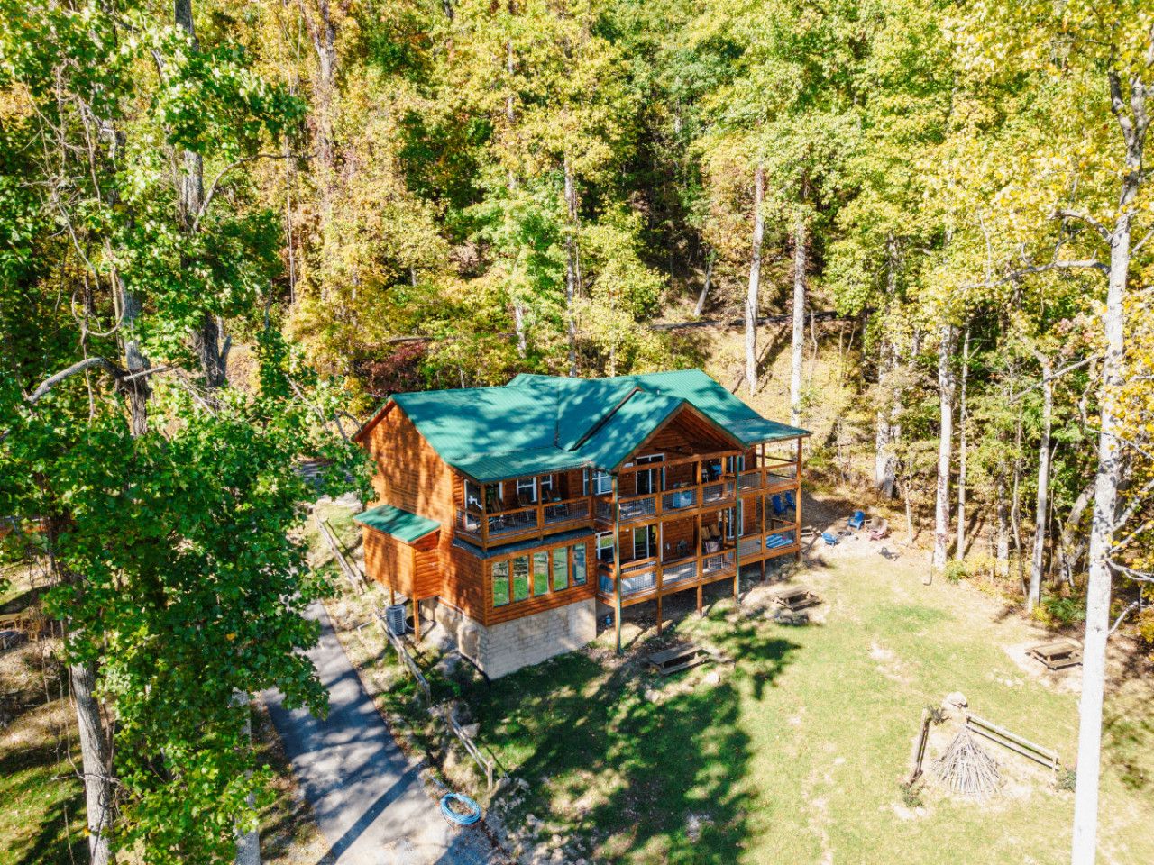 Nestled in a serene meadow and surrounded by lush forest, **Twin Summit Resort** offers two side-by-side luxury cabins, blending tranquility, space, and mountain elegance—perfect for unforgettable gatherings.