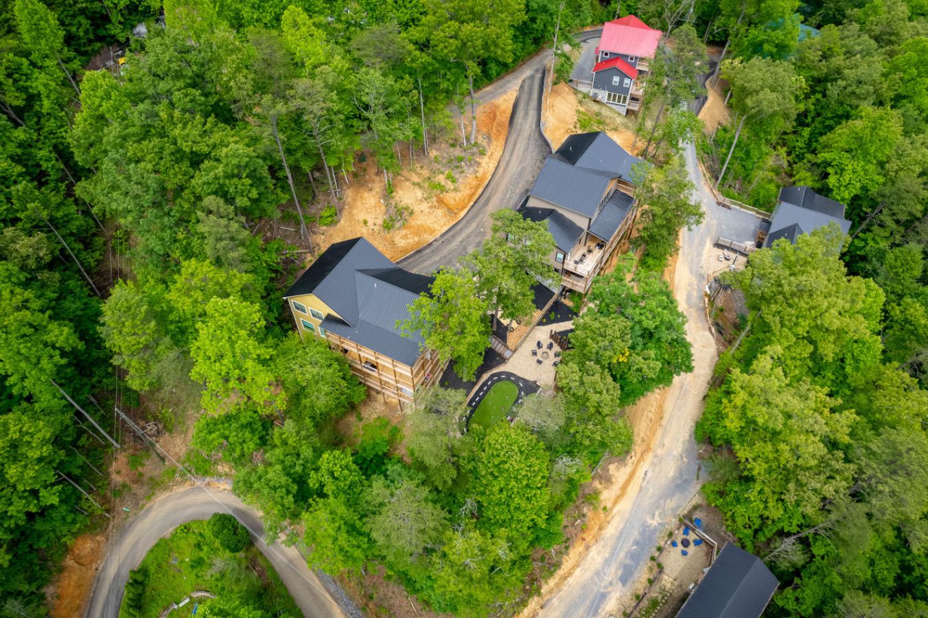 Summit Luxe Resort—two side-by-side luxury cabins with a shared garden, sparkling pools, and breathtaking Smoky Mountain views.