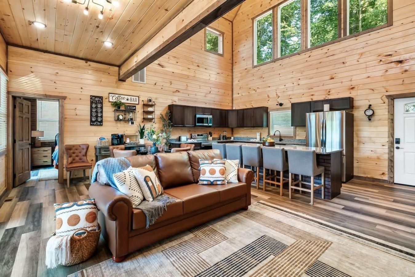 Cabin 1: Living room with cozy sofas and HD TV.