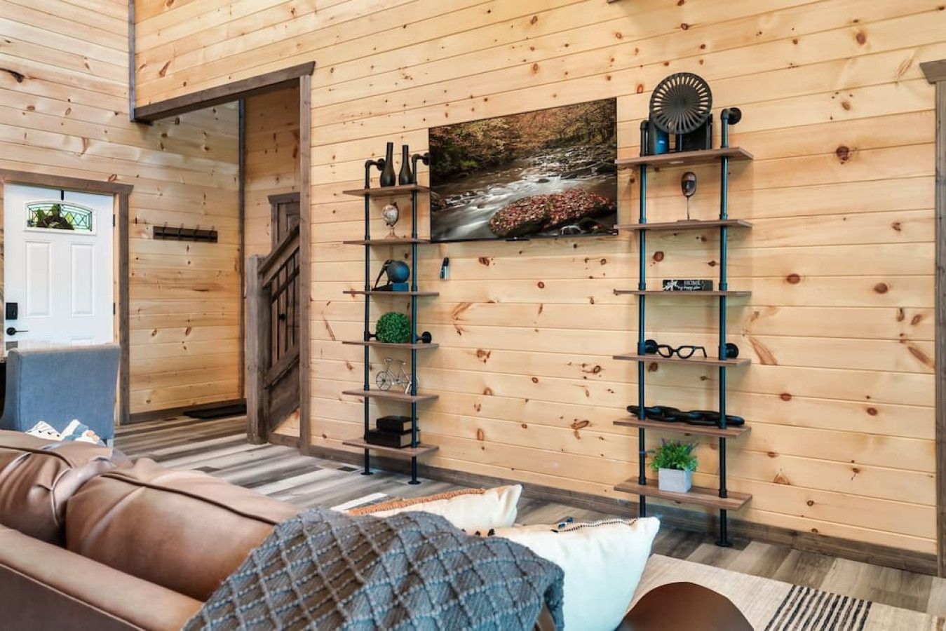 Cabin 1: Living room with cozy sofas and HD TV.