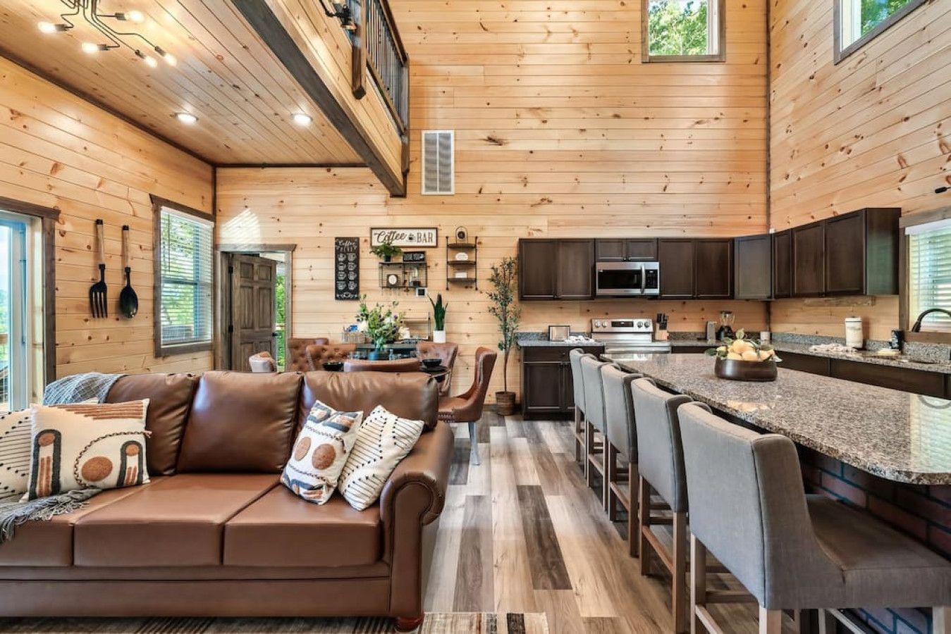 Cabin 1: Living room with cozy sofas and HD TV.