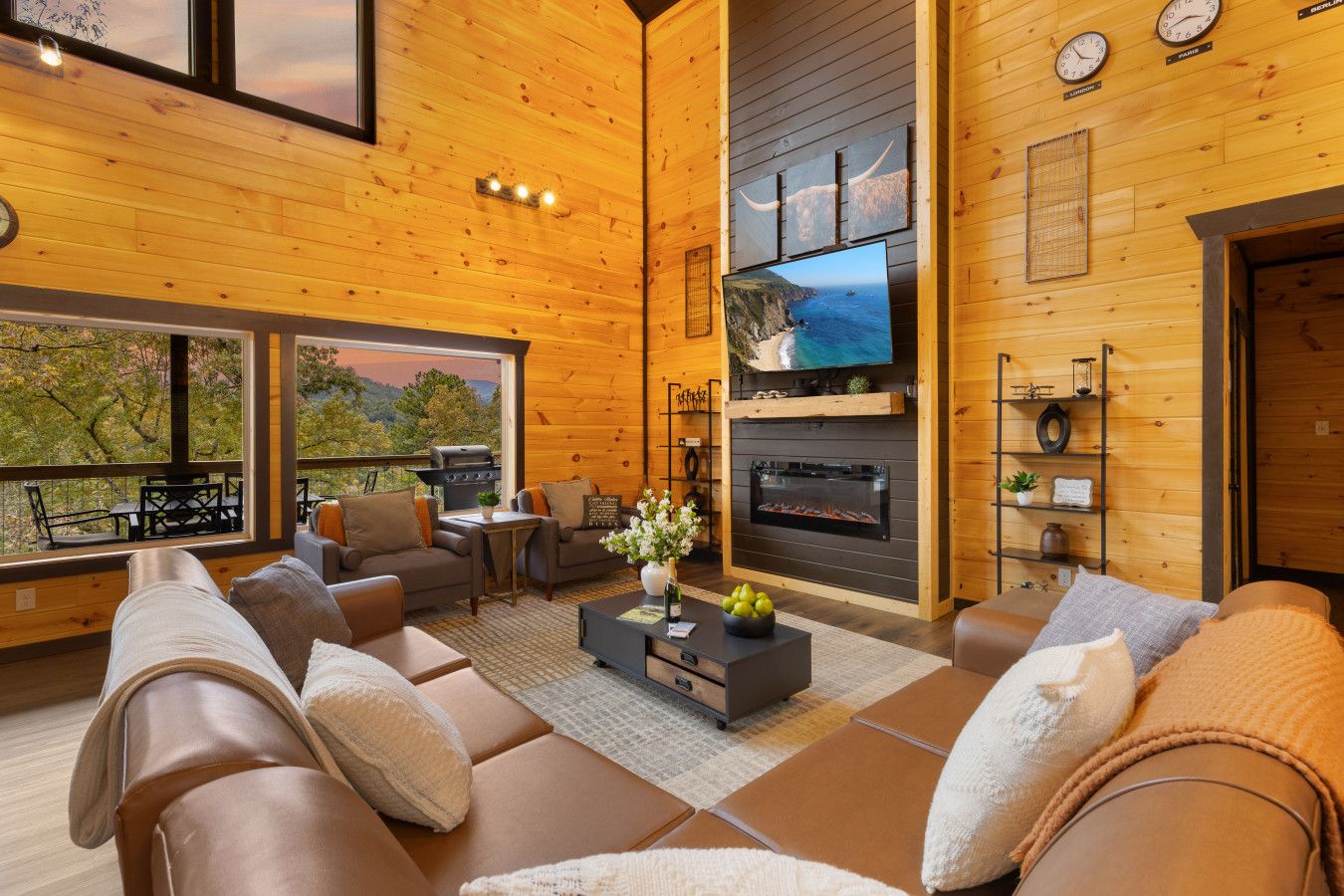 Cabin 1: Spacious living room with comfortable seating, TV, and a cozy lounge area.