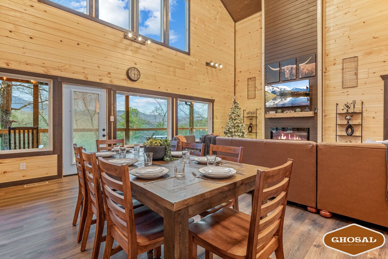 Cabin 1: Spacious living room with comfortable seating, TV, and a cozy lounge area.