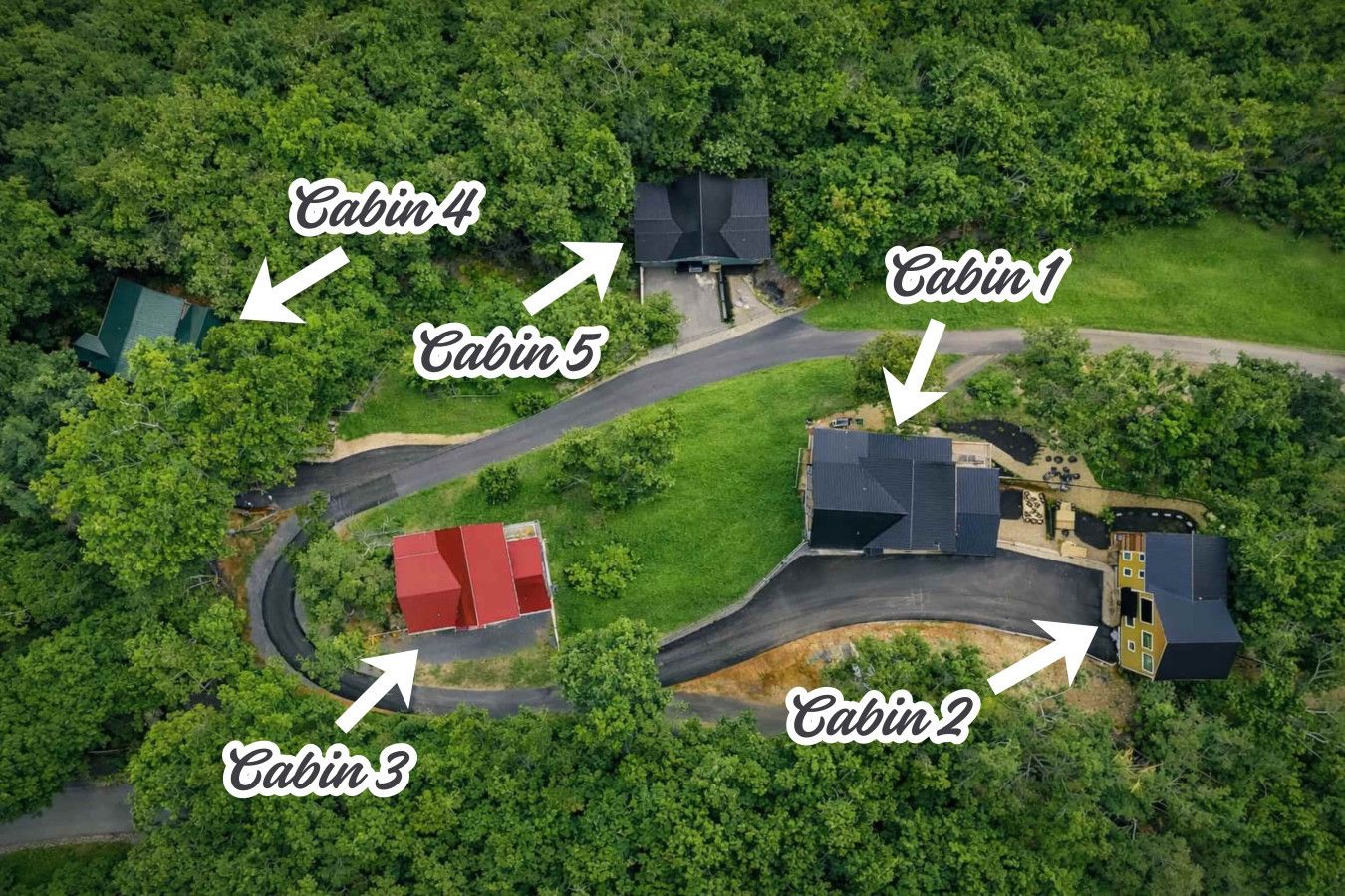 Private mountain resort featuring multiple luxury cabins with expansive decks and peaceful surroundings.