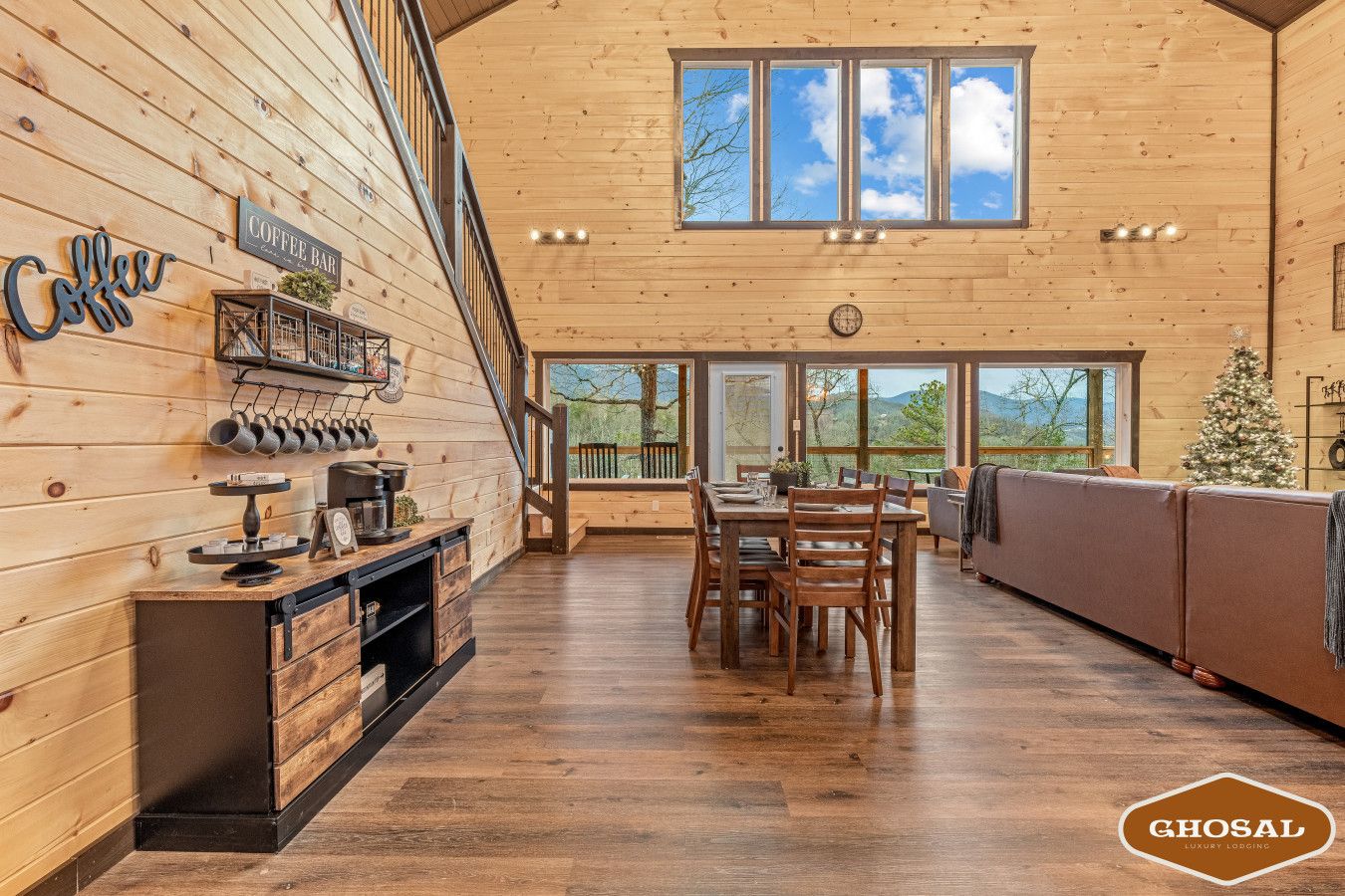 Cabin 1: Spacious living room with comfortable seating, TV, and a cozy lounge area.