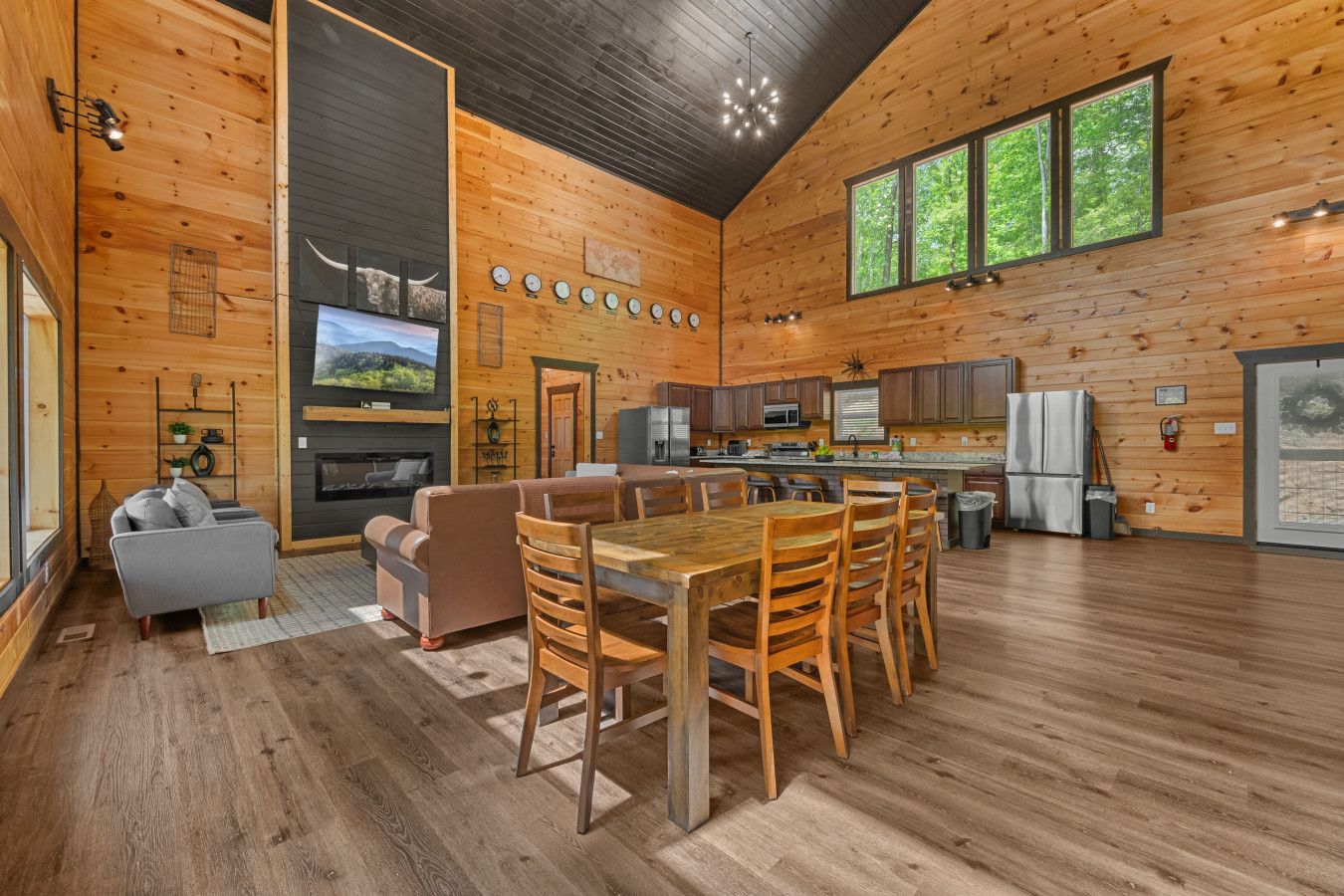 Cabin 1: Spacious living room with comfortable seating, TV, and a cozy lounge area.