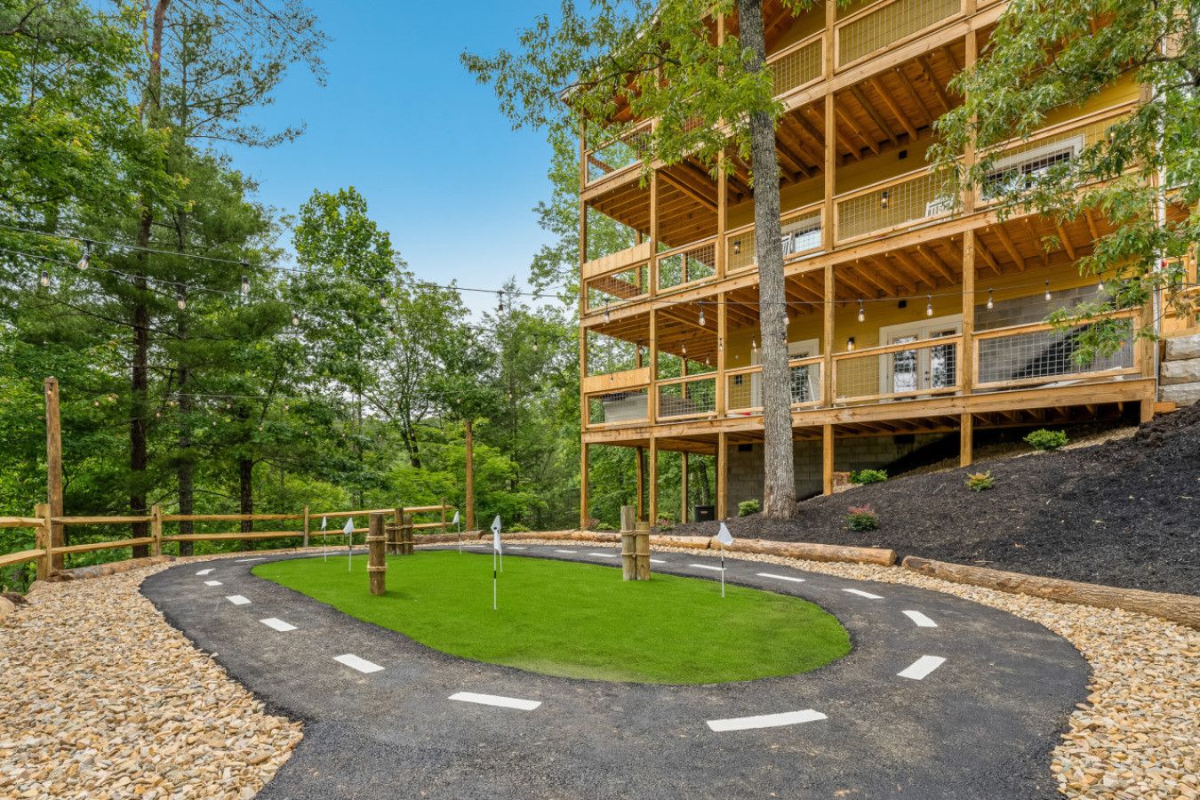 Enjoy resort-style outdoor amenities including mini golf, fire pit areas, kids games, and private outdoor spaces surrounded by nature.