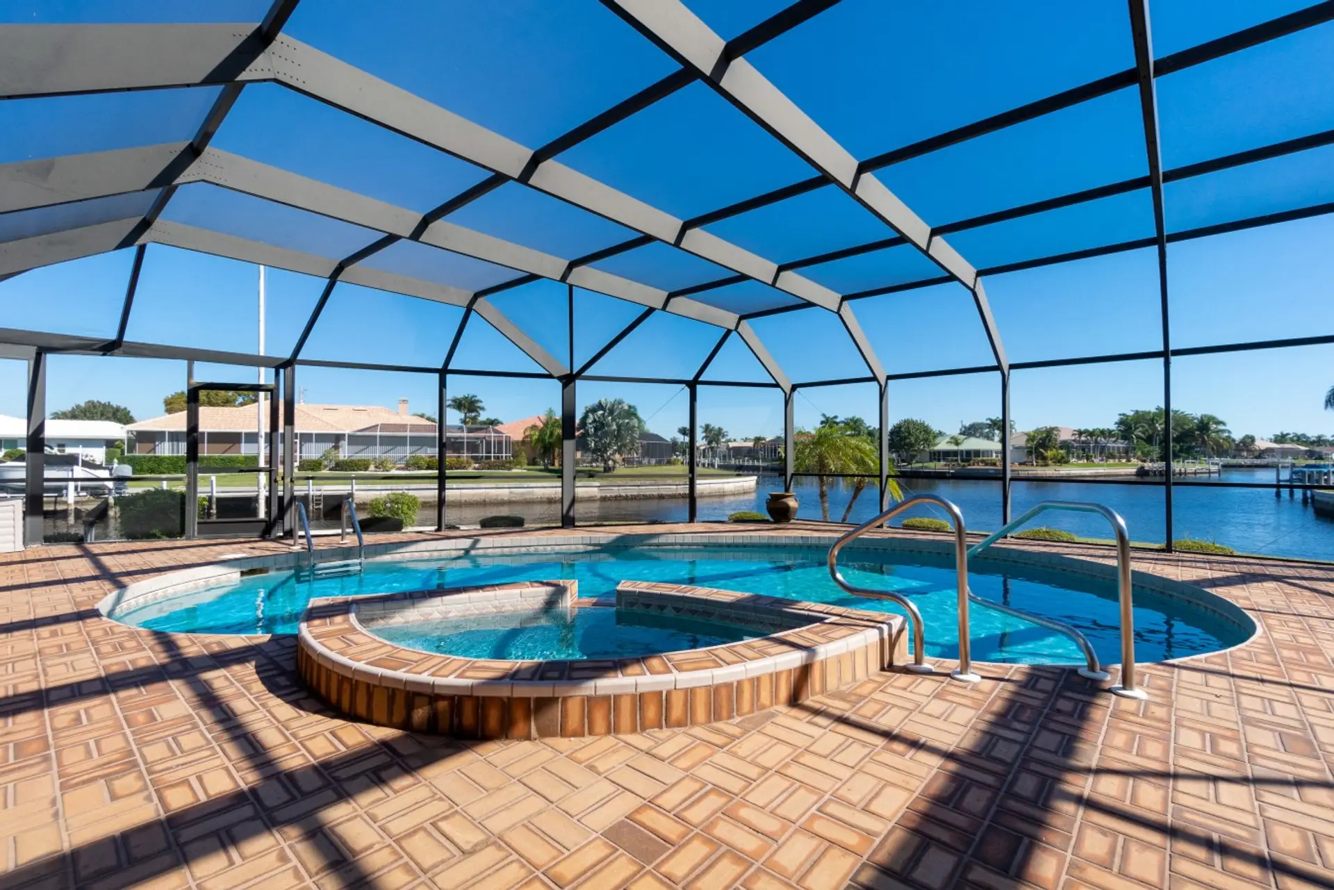 Outdoor lanai with heated, saltwater pool and hot tub