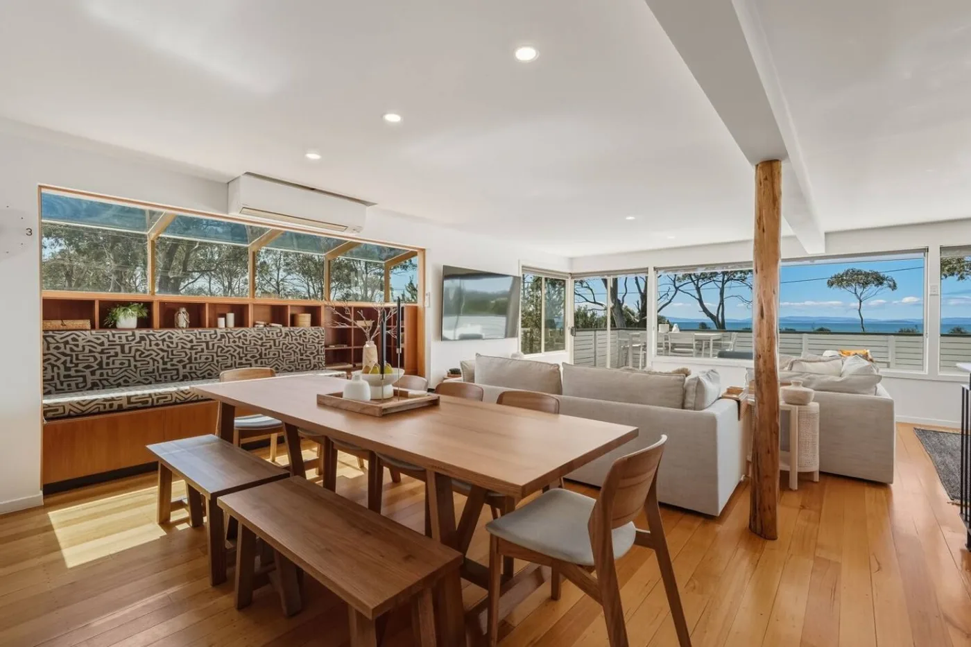 Open-plan dining and living room with ocean views