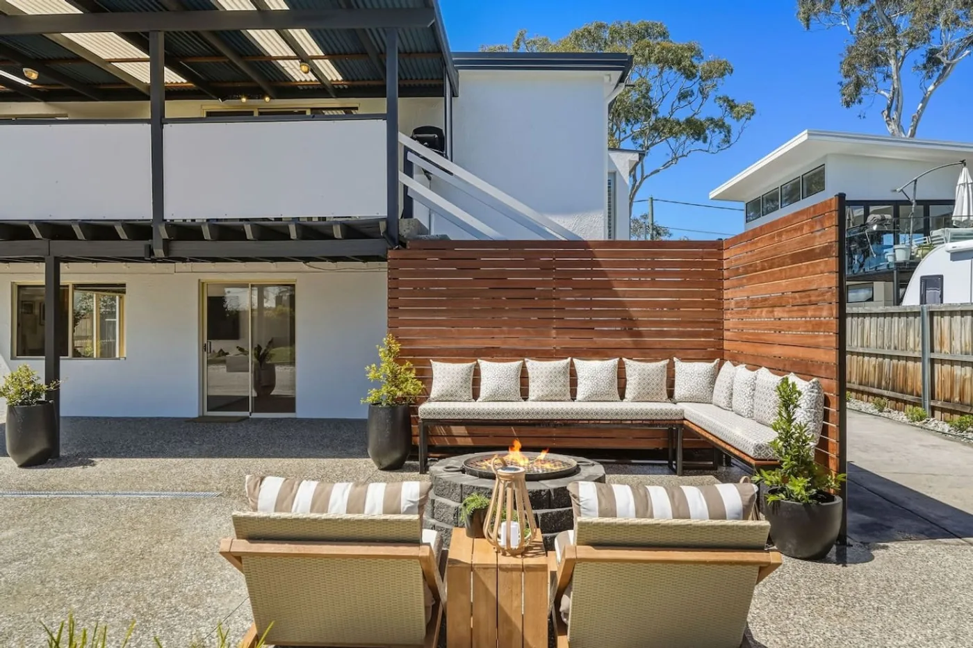 Private rear entertaining area with fire pit and outdoor seating