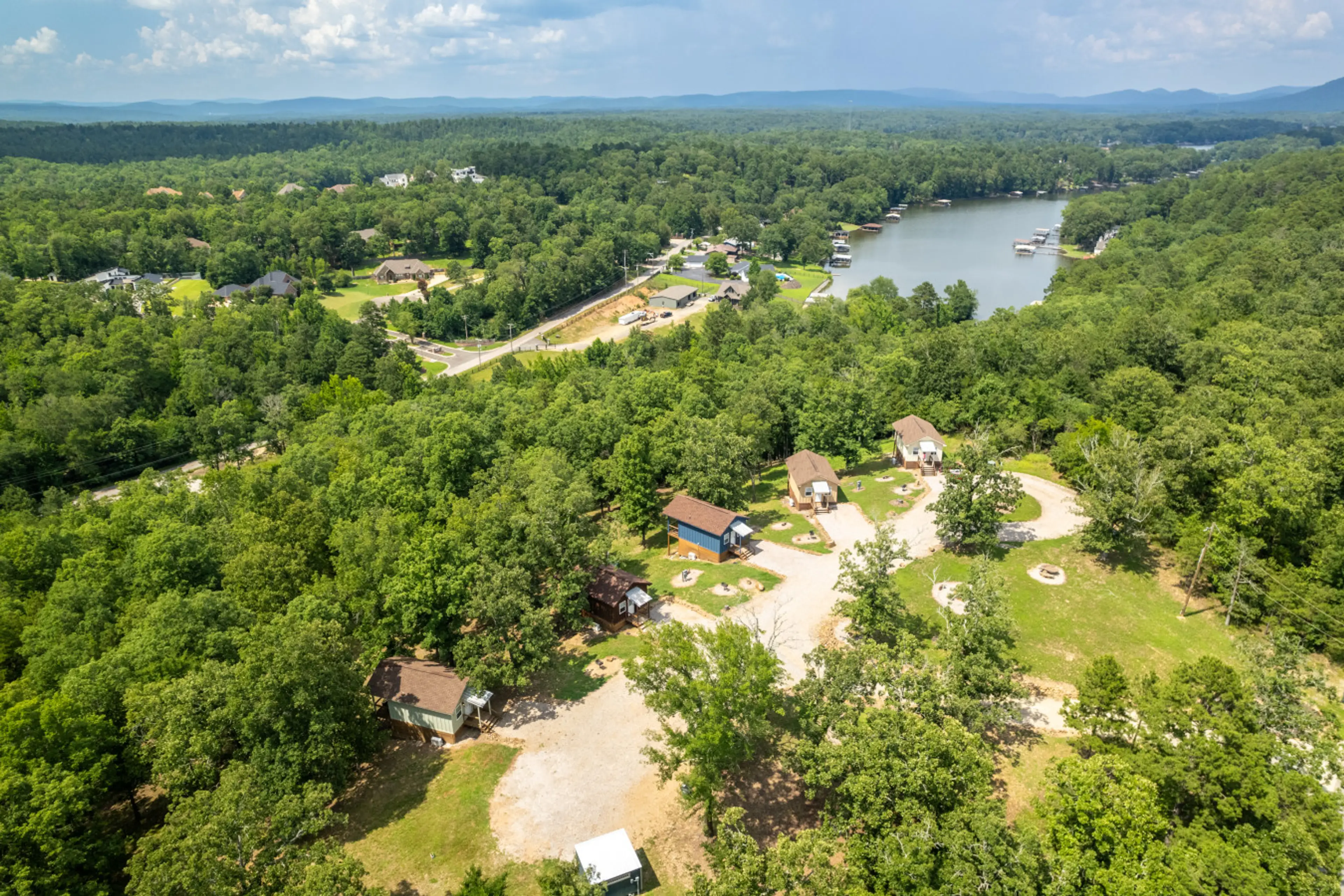 Aerial View of Rock Creek Cabins with Lake Hamilton and the Ouachita Mountains beyond...