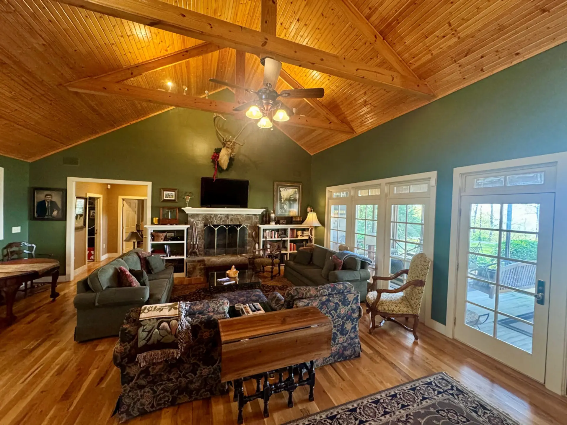 Large living room with wood burning fireplace and comfortable seating.