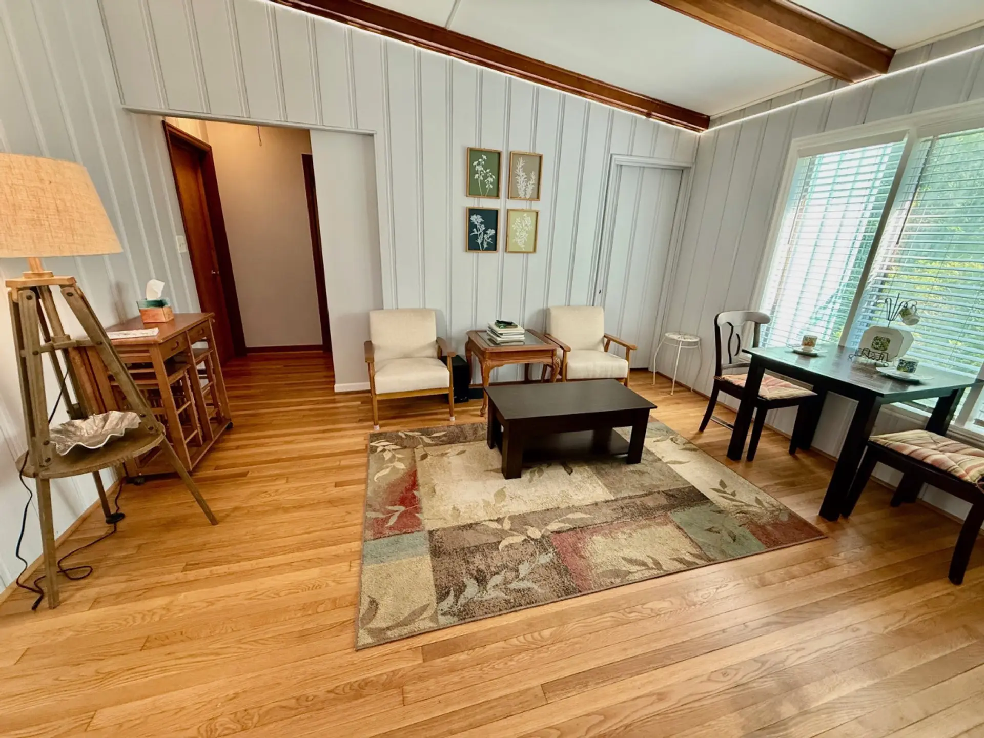 Front living room with small dining area.