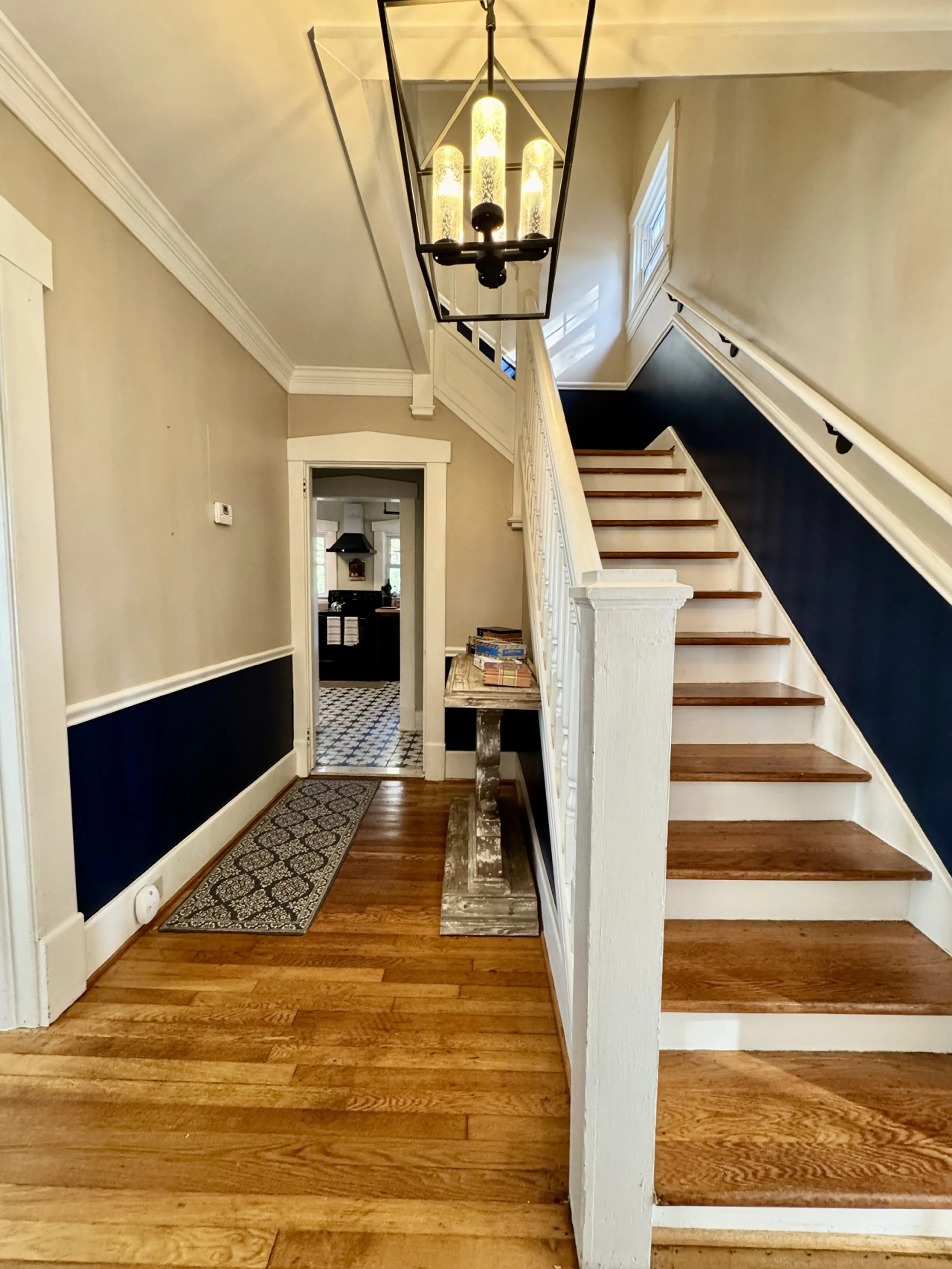 Entryway stairs lead to 4 bedrooms upstairs and 1 bedroom downstairs.