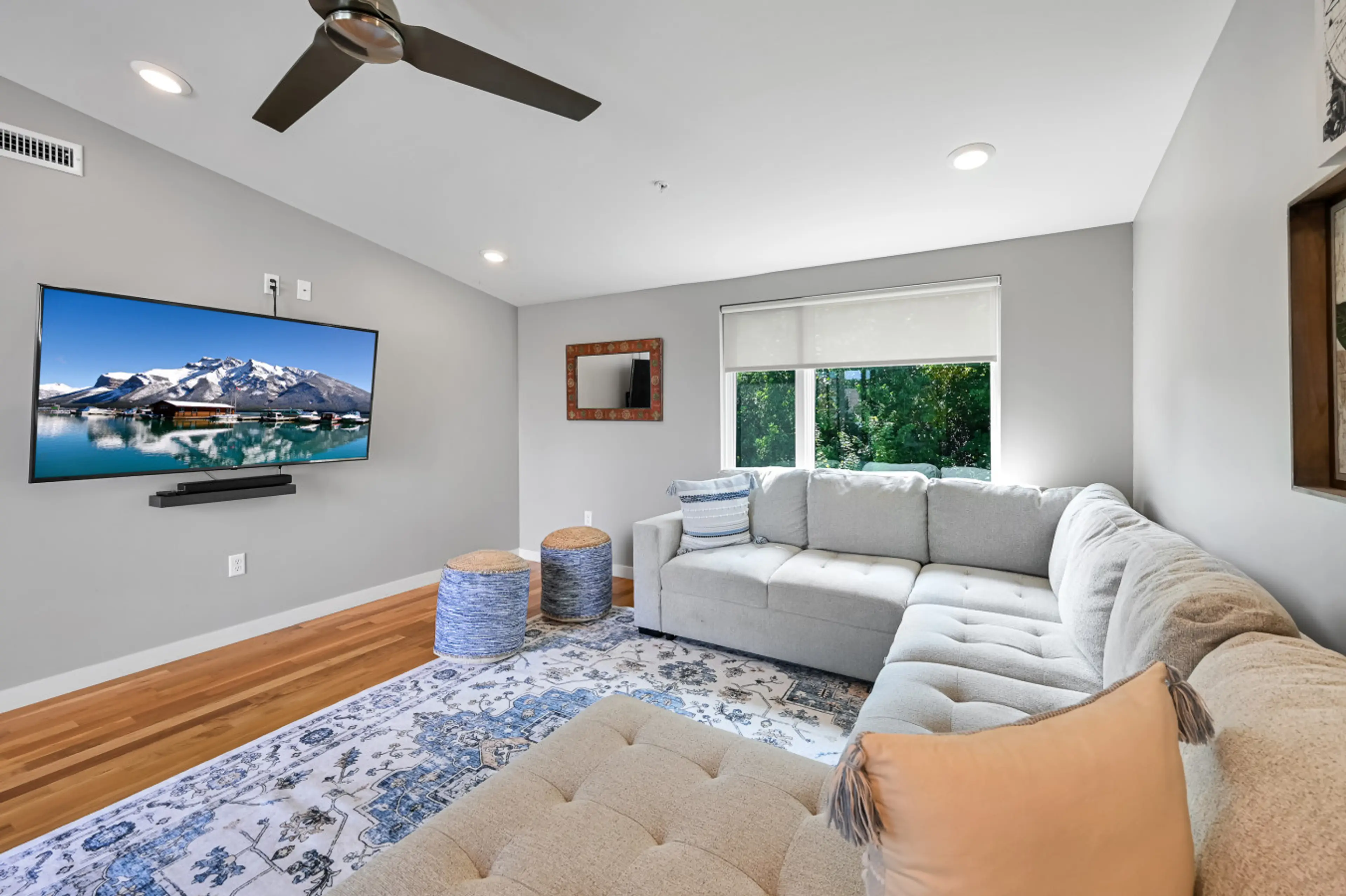 Loft den with surround sound TV, game table, and terrace with gas grill