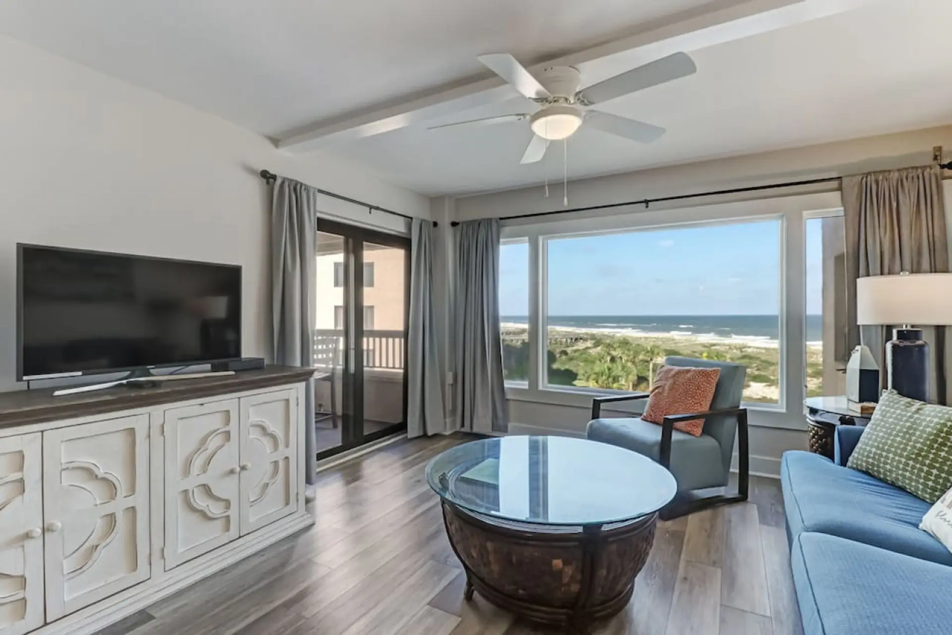 Ocean view living room with access to outdoor balcony