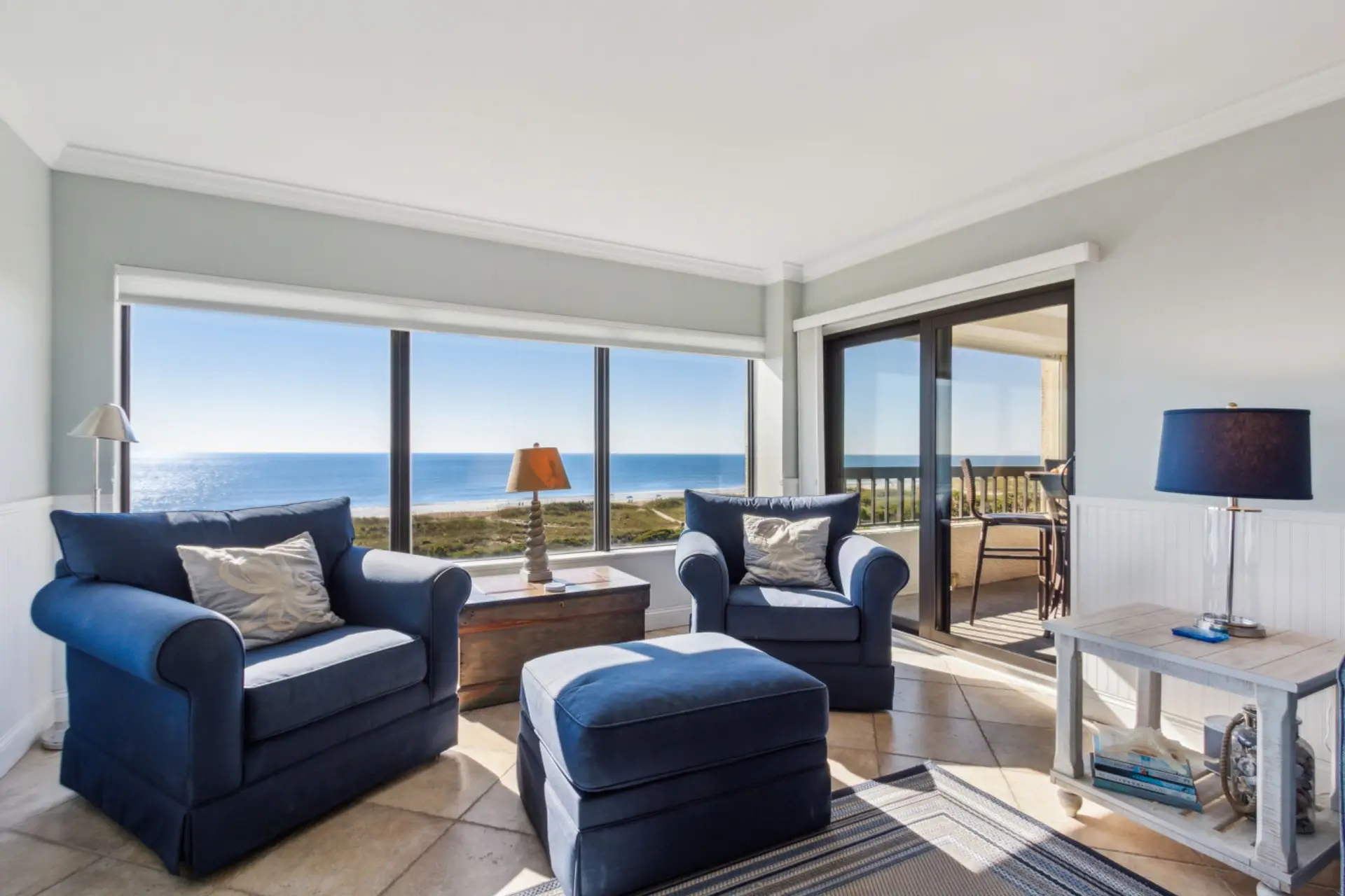 Living room with cable tv and sliding glass door to balcony