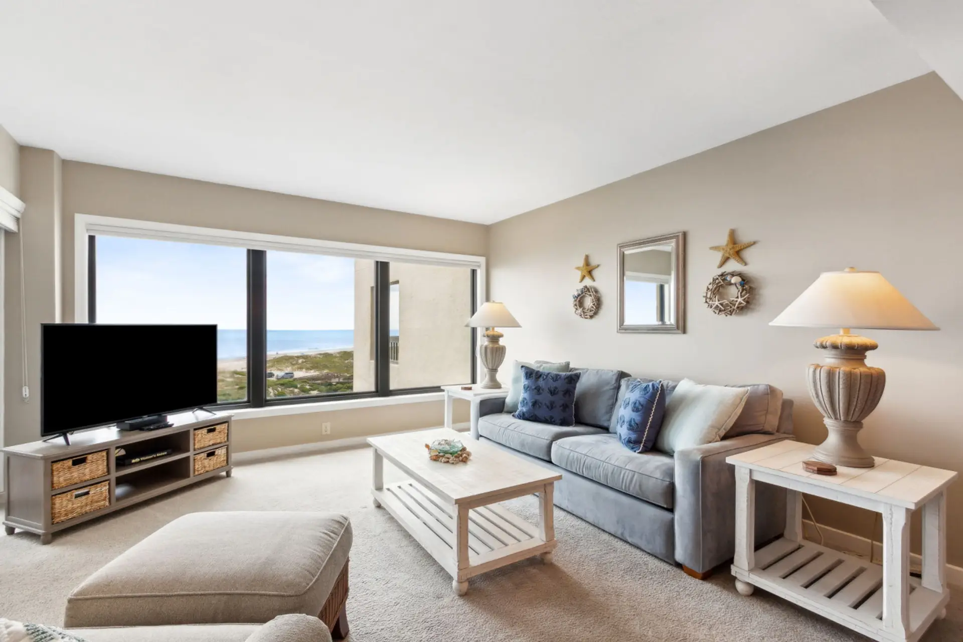 Living room with cable tv and lots of natural light